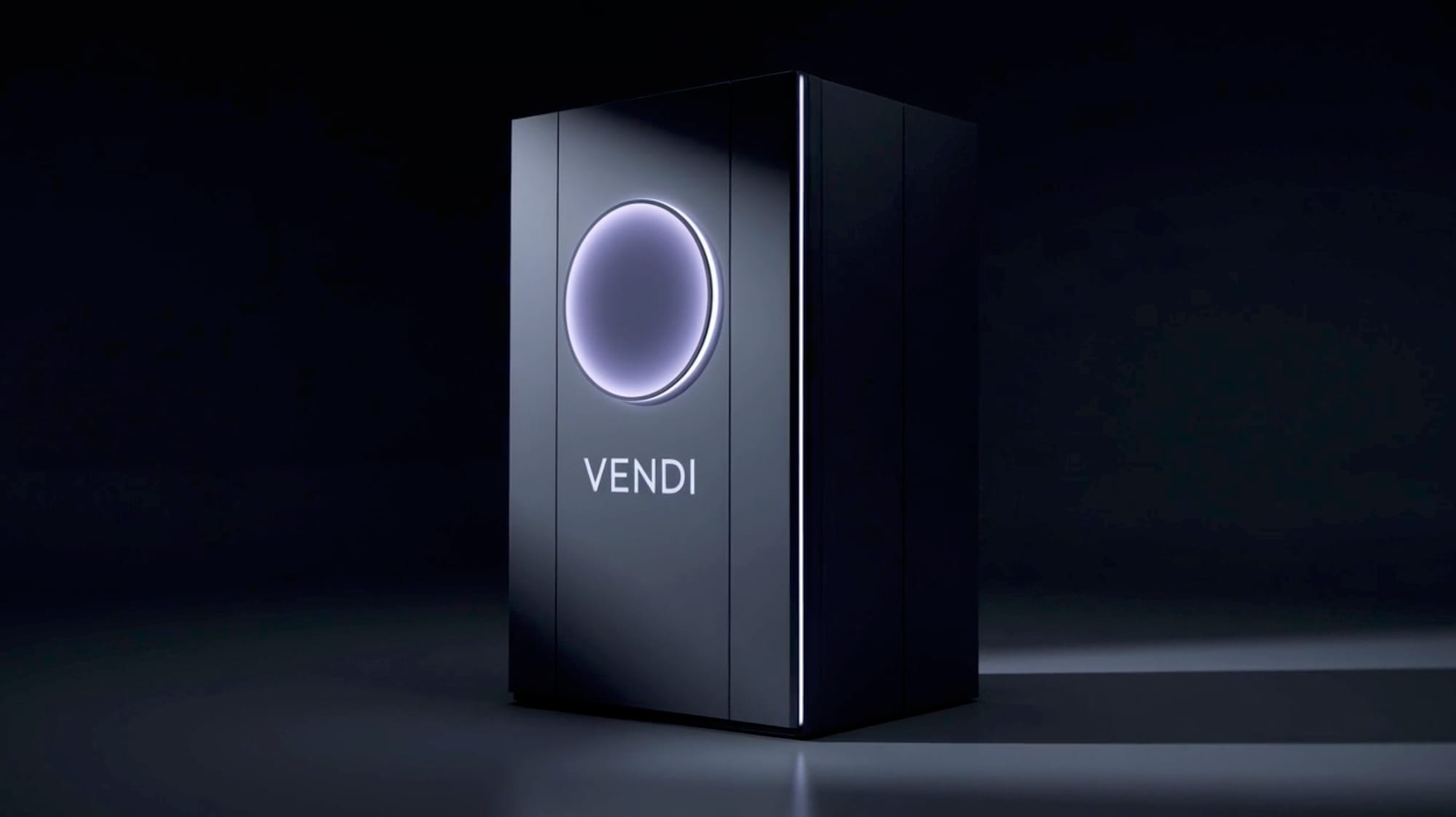 The Vendi machine: a dark cabinet with a glowing round window and the word VENDI.
